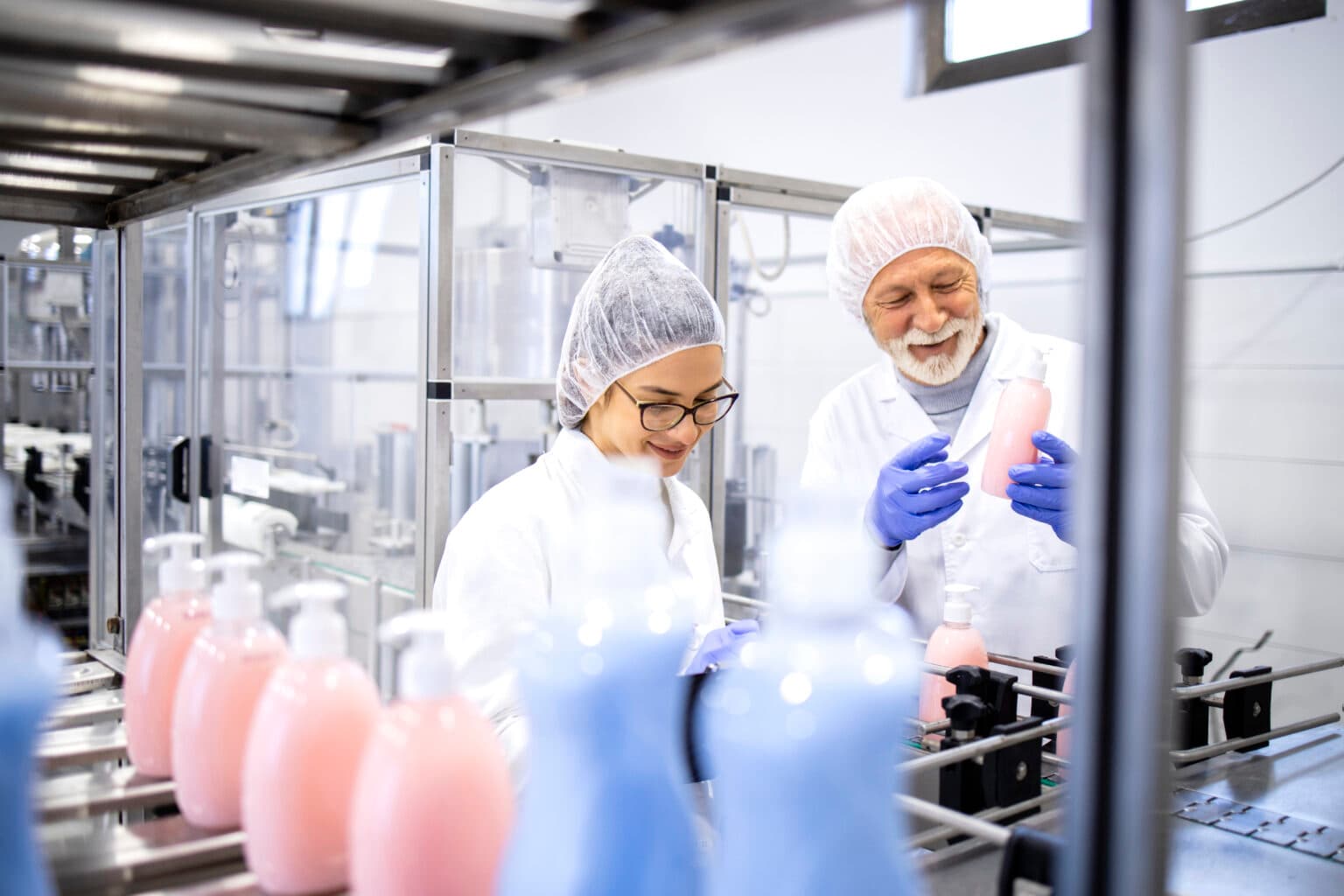 Workers collaborating in FMCG manufacturing facility