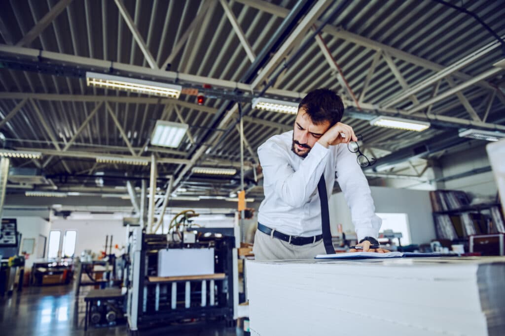 FMCG manufacturing supervisor reviewing production data