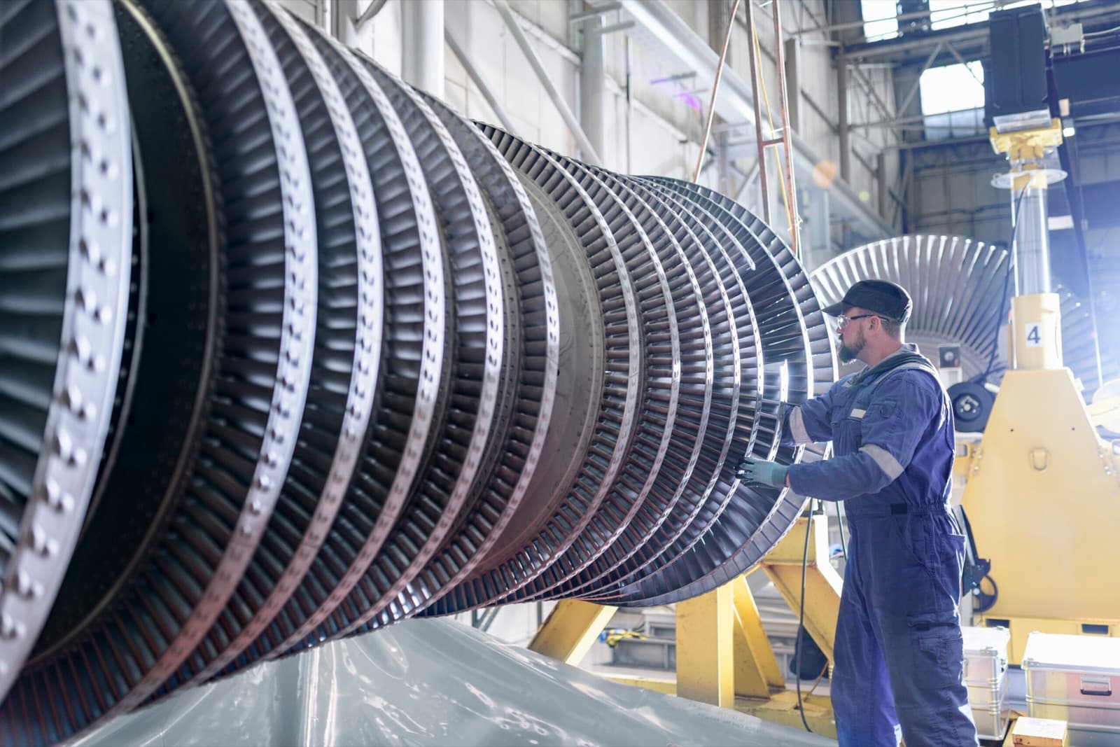 Engineer working on high-pressure steam turbine in machinery manufacturing
